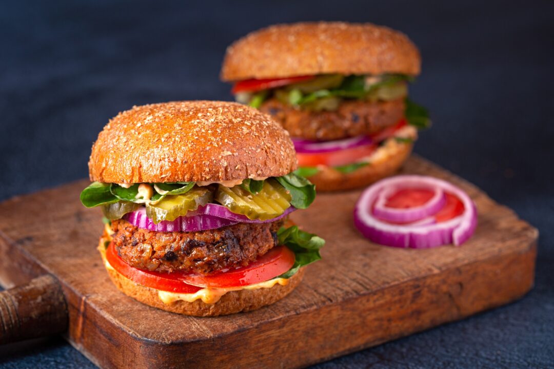 Homemade plant based burger made from sweet potato, black beans and brown rice on a whole wheat brioche bun