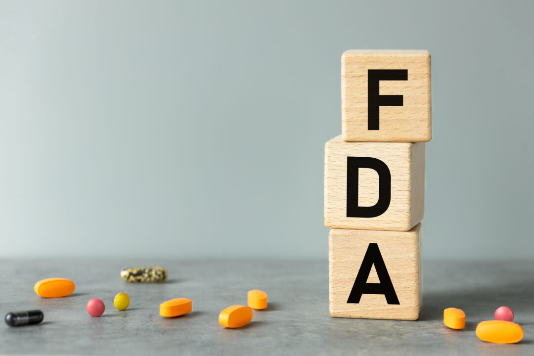 FDA, words on wooden blocks and nutritional supplements.