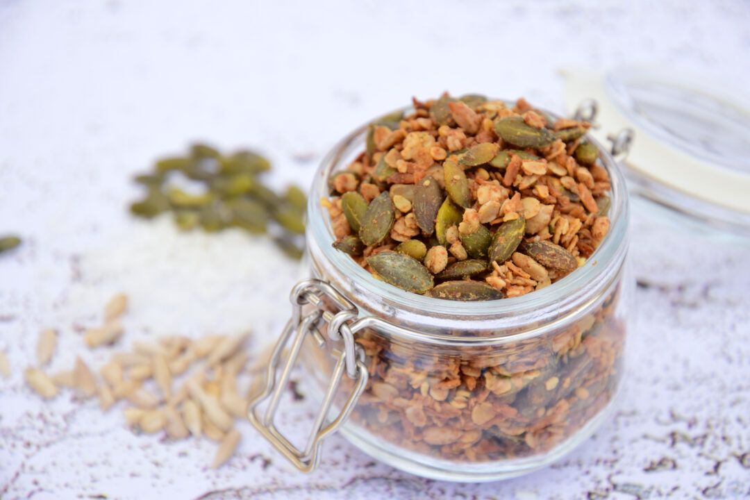 Healthy snack of pumpkin seeds and granola