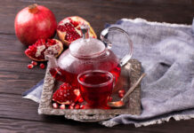 Fruit pomegranate tea in a teapot and cup. Turkish tea. Oriental tea ceremony concept.