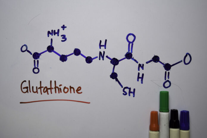 Glutathione molecule written on a white board. Structural chemical formula. Education concept