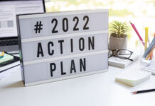 2022 action plan text on light box on desk table in office.Business motivation or management.