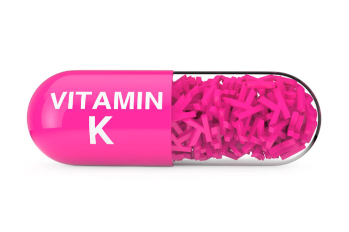 Vitamin K Capsule Pill on a white background 3d Rendering