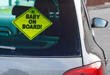 merchandising insights staffing baby on board sign on car
