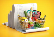 grocery basket with receipt and fruit and bread and meat
